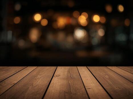 An empty wooden table top with a dark, blurred background of a bar or cafe at night with warm bokeh lights. photo