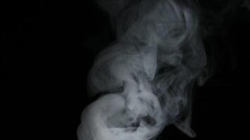 Smoke slow motion on a black background video