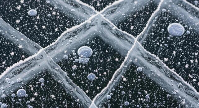 Intricate frozen patterns of ice with trapped air bubbles forming a mesmerizing crystalline texture photo