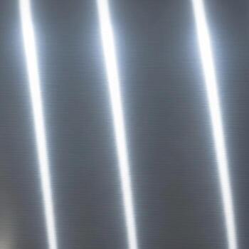 Abstract diagonal light streaks across a textured gray surface creating a modern and dynamic visual effect photo