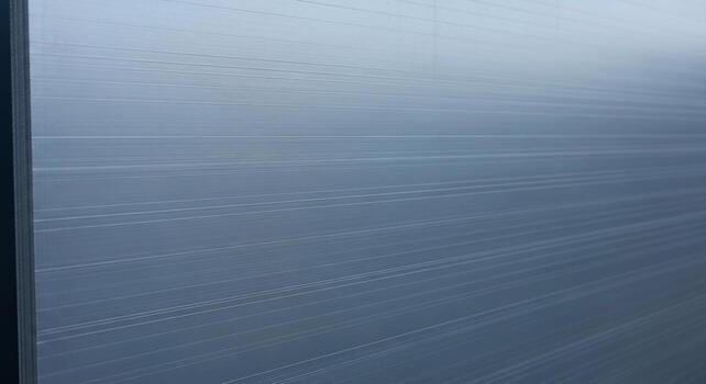 Subtle textured background with a gradient of cool blue and gray tones creating a calm and serene atmosphere photo