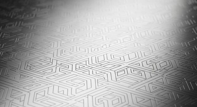 Abstract geometric pattern illuminated by a dramatic spotlight on a textured metallic surface photo