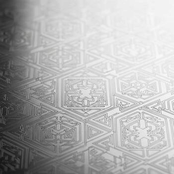 Intricate geometric pattern with floral motifs embossed on a metallic surface with subtle gradient lighting photo
