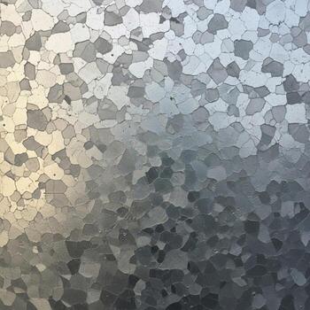 Close up textured abstract pattern of frosted glass with dappled light creating a shimmering metallic effect photo