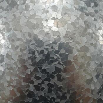 Abstract mosaic of fractured geometric shapes in muted grayscale and subtle green tones creating a textured fragmented visual effect photo