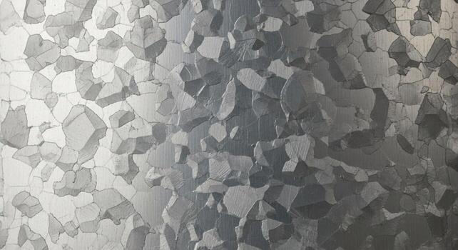 Abstract close up texture of frosted glass with a subtle floral or leaf like pattern creating a soft diffused light effect photo
