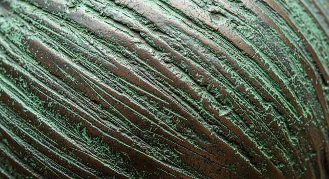 Close up abstract view of weathered green and brown textured surface with diagonal lines and organic patterns photo