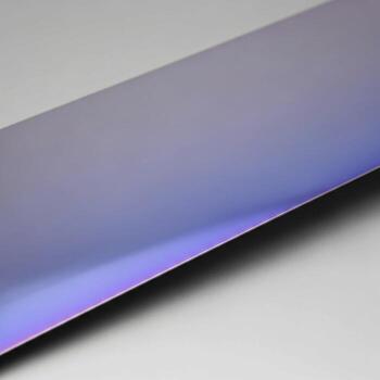 Abstract metallic surface with subtle iridescent hues reflecting light and shadow in a gradient pattern photo