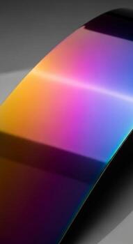 Abstract spectrum of light and color gradient displayed on a sleek modern surface with subtle reflections photo