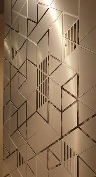 Geometric frosted glass panel with interlocking cubic patterns and subtle vertical lines creating a modern abstract design photo
