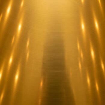 Abstract golden light streaks create a shimmering ethereal glow with a blurred background suggesting movement and warmth photo