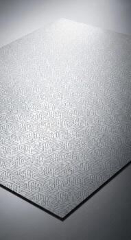 Close up abstract texture of a metallic surface with a subtle geometric pattern and soft lighting photo