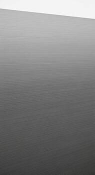 Subtle gradient of cool gray tones transitioning smoothly across a textured surface photo