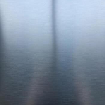 Abstract blurred background with soft vertical lines and a subtle gradient of cool blue and grey tones creating a serene atmosphere photo