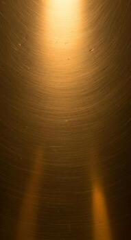 Warm golden light beams illuminate a textured metallic surface creating an abstract and atmospheric backdrop photo