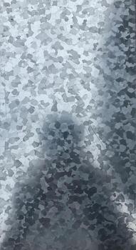 Abstract textured surface with shimmering light reflections creating a dynamic and visually engaging pattern photo