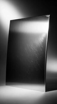 Abstract metallic surface with dramatic lighting creating a sense of depth and reflection photo