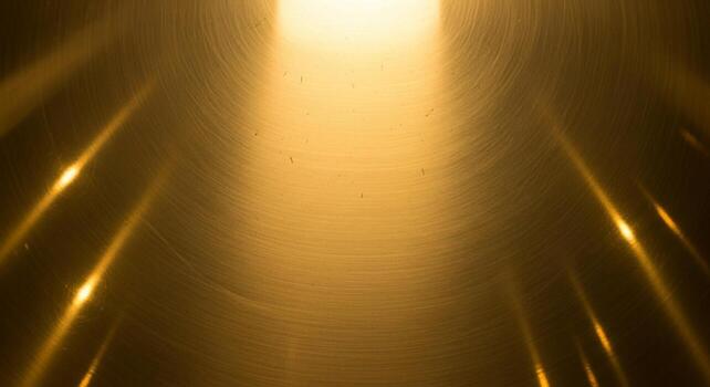 Golden light beams emanating from a bright source creating a dramatic and ethereal atmosphere with shimmering highlights photo