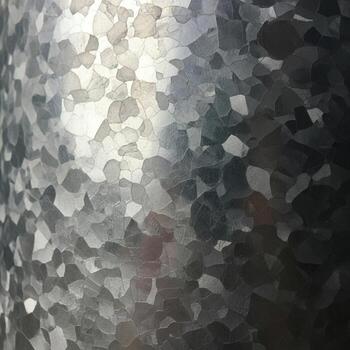 Abstract mosaic of shimmering iridescent fragments creating a textured light reflecting surface with subtle color variations photo
