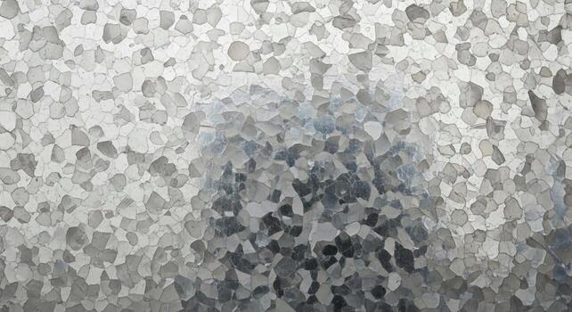 Abstract textured background with a mosaic of irregular shapes in grayscale and subtle hints of color photo