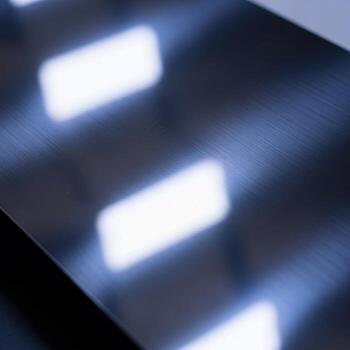 Abstract reflection of bright rectangular lights on a dark textured surface creating a modern geometric pattern photo