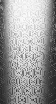 Abstract geometric hexagonal pattern with a metallic sheen and subtle gradient lighting creating a futuristic texture photo