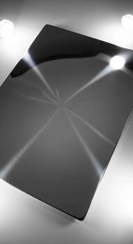 Abstract geometric pattern formed by light reflections on a dark polished surface creating a futuristic modern aesthetic photo