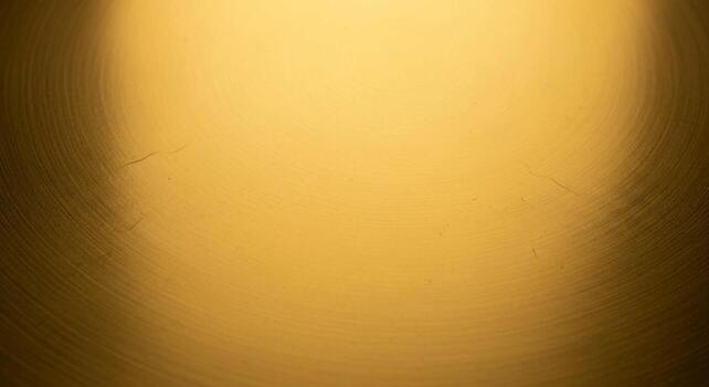 Warm golden light illuminates a textured surface creating a soft gradient with a subtle pixelated effect and rich inviting tones photo