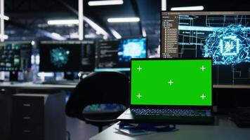 Close up of mockup notebook in data center supporting AI training workflows and automation of systems. Isolated screen laptop in server room tracking hardware processing deep learning datasets video
