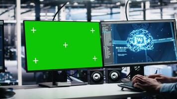 Data center engineer working on neural network software development on green screen PC. Server room IT specialist implementing machine learning technology using mockup computer, camera A video
