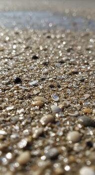 Close up view of a textured gravel surface with small stones and pebbles creating a natural abstract pattern photo