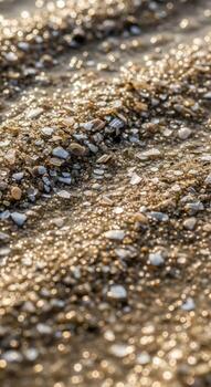 Close up abstract view of shimmering golden and brown pebbles creating a textured natural pattern photo