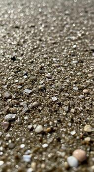 Close up view of a textured gravel surface with small stones and pebbles creating an abstract natural pattern photo