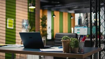 Empty modern office in a multinational company awaits strategy meeting. Charts, digital tools and planning documents reflecting professional environment focused on growth and development. video