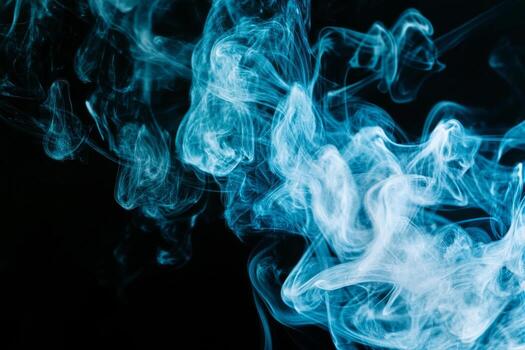 Smoke Swirling in Different Shapes Against a Dark Background Creates an Abstract Visual Effect photo
