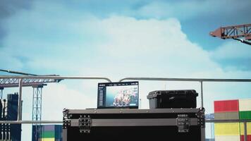 Laptop on offshore platform with predictive software analyzing rig operations. Notebook on drilling barge deck with remote control interface managing rig equipment, tracking production efficiency video