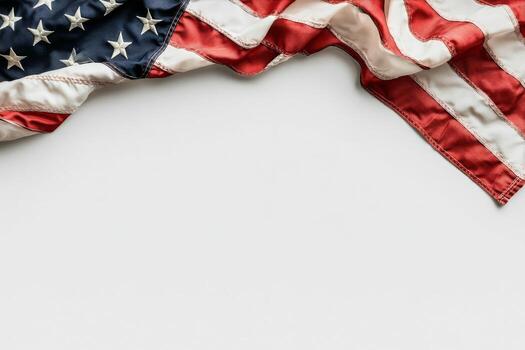 American Flag Draped in Soft Fabric Against a Plain Background Showcasing Patriotic Colors photo