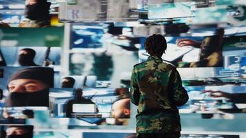 Air defense commander using radar systems on laptop program to detect incoming ballistic missiles. Army soldier in base of operations scanning enemy rockets using notebook software, camera A video