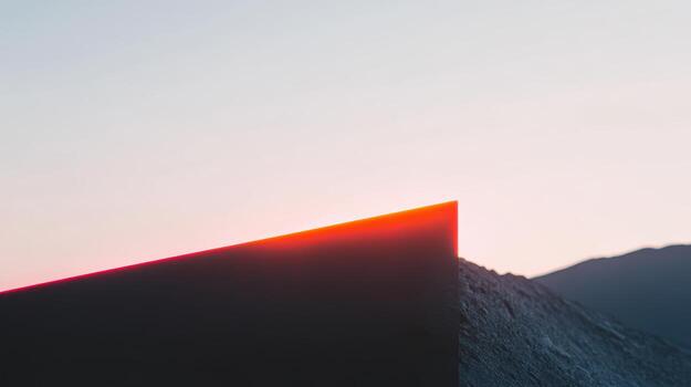 Sunrise over mountain peak with sharp horizon line photo