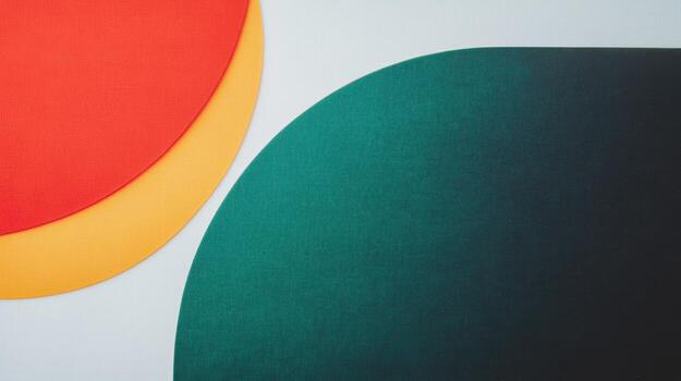 Colorful arrangement of paper shapes on a flat surface photo