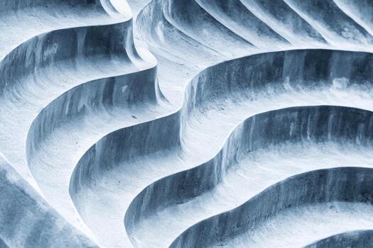 Abstract close-up of textured waves in a stone surface photo