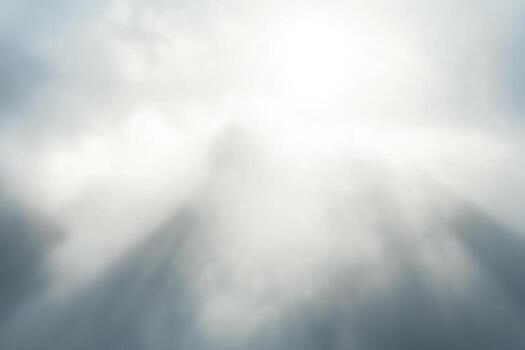 Soft clouds and rays of light in a serene sky photo