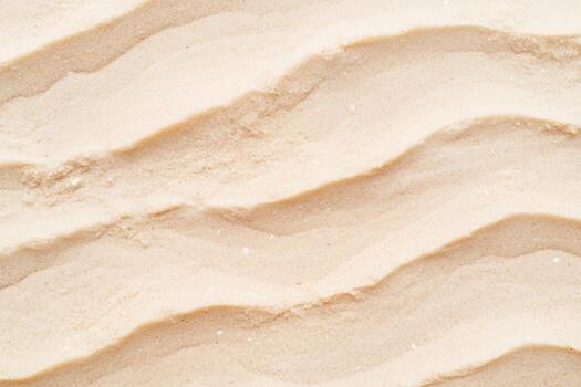 Rippling sand patterns create a natural art piece in sunlight photo