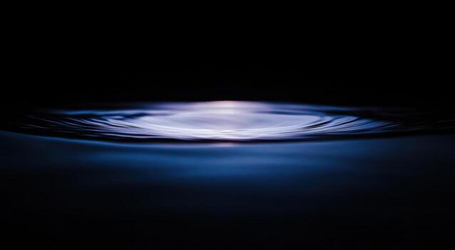 Soft ripples in dark water create a calming effect photo