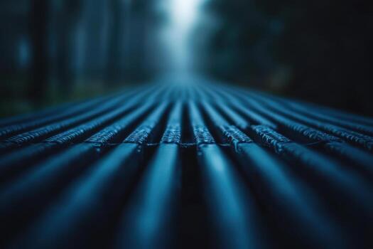 Calm blue pathway leading into a misty forest at dusk photo