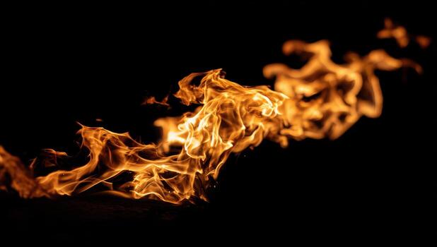 Flames dancing in the dark at a night gathering photo