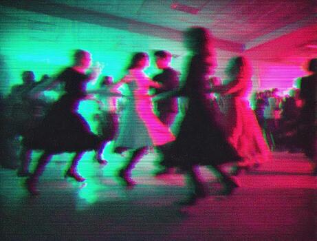 Group dancing at night event with colorful lights photo