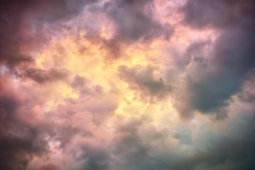 Colorful clouds create a dramatic sky at sunset hours photo