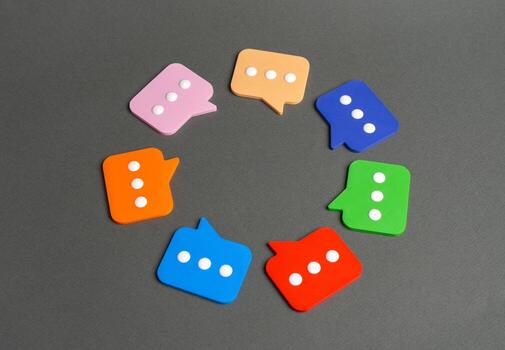 Comment symbols in a circle. Meeting and discussing matters, sharing opinions and feedback. Communication, collaboration, and public discussion. Media, forums, and social platforms. photo