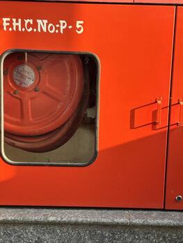 A red fire engine with a window that says fh-nop 5 photo